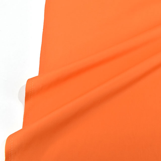 生地 T/Cブロード(AD40000) 142.オレンジ 09Bm29_